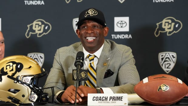 Deion Sanders speaks at an introductory press conference.